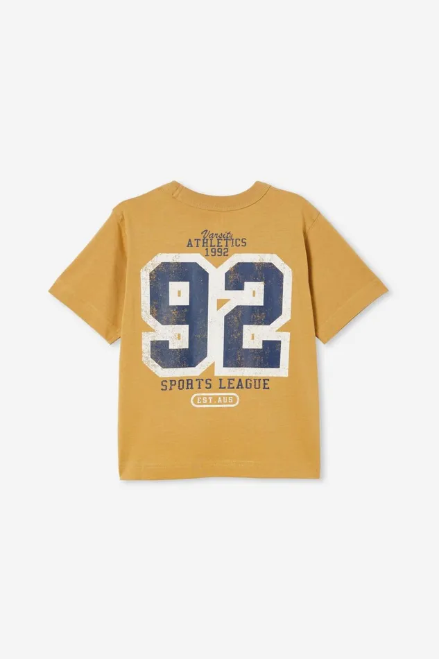 Boys Tops and TShirts Cotton On Jonny Short Sleeve Print Tee Mustard Seedvarsity Athletics 1992